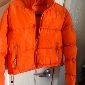 Cropped orange puffer coat